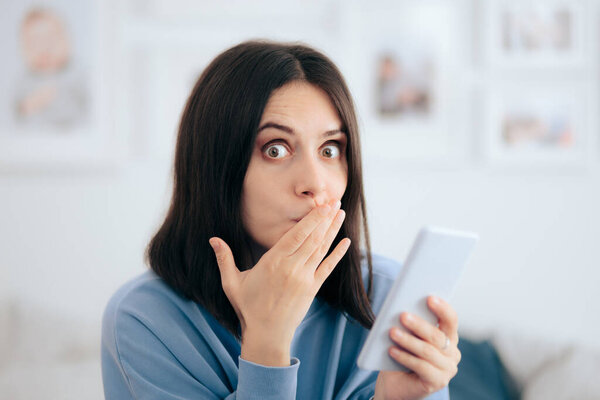 Funny Woman Holding Smartphone at Home