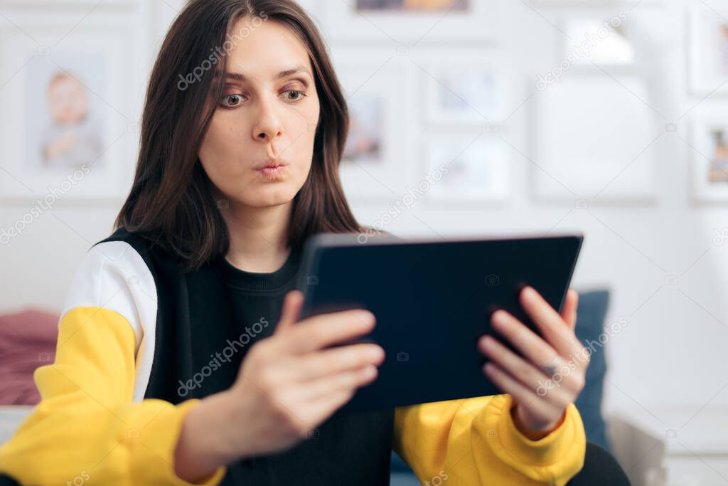 Cheerful Woman Holding PC Tablet at Home