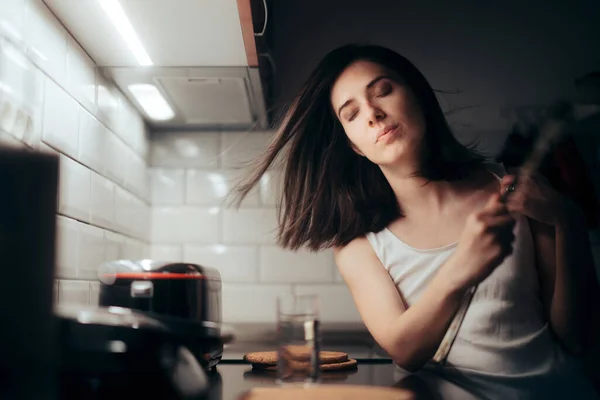 Woman Fanning herself During Nigh Time Complaining of Heat