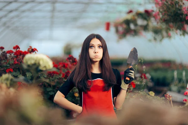 Stressed Greenhouse Worker Holding Gardening Tools — Stock Photo, Image