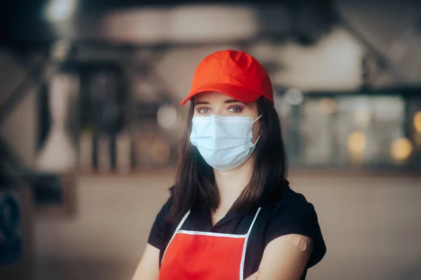 Fast Food Employee Wearing Face Mask Ready for Business Reopening