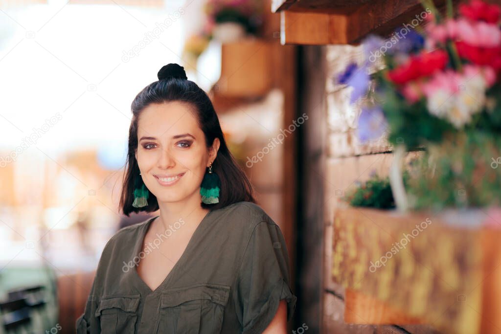 Cool Fashionable Woman with Hair Bun and Tassel Earrings