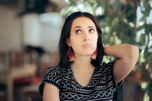 Funny Bored Woman Sitting in a Restaurant