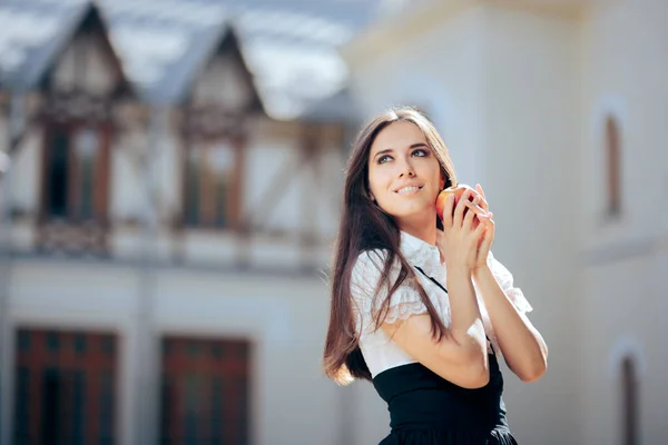 Snow White Princess Holding a Red Apple