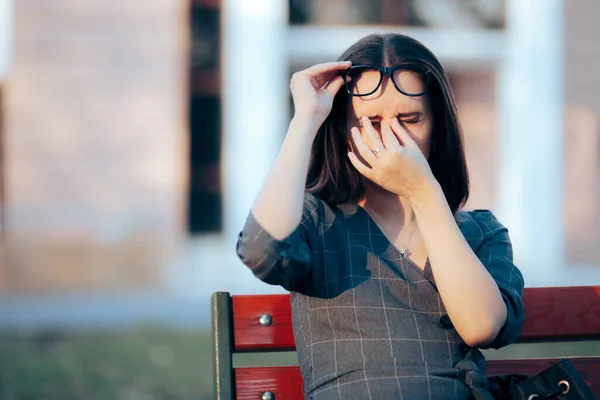 Tired Woman Wearing Eyeglasses Rubbing Her Eyes — Stockfoto