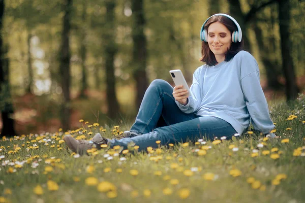 Woman Headphones Checking Smartphone Nature — Stock Photo, Image