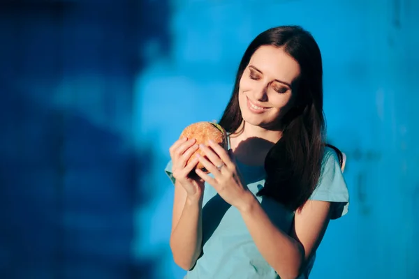 Beautiful Young Woman Holding Delicious Burger — Stok Foto