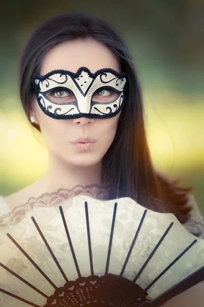 Surprised Young Woman with Mask and Fan — Stock Photo, Image