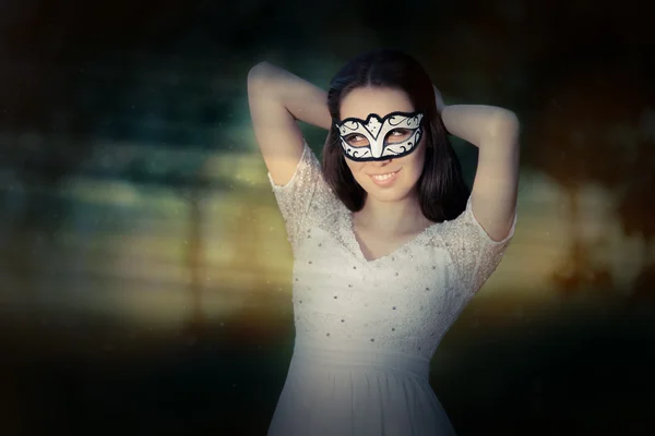 Young Woman Putting on a Mask — Stock Photo, Image