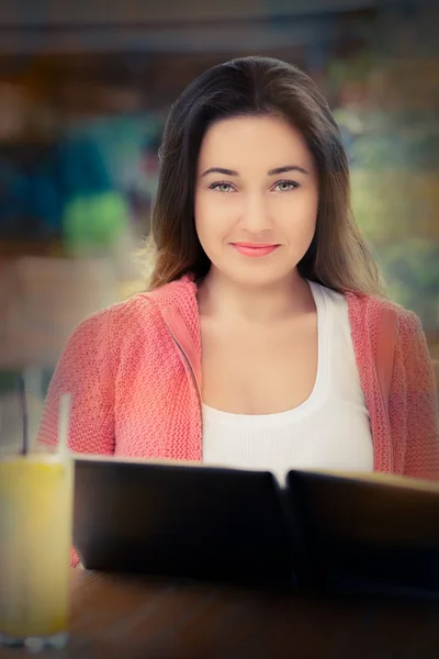 Young Woman Choosing from a Restaurant Menu — Stock Photo, Image