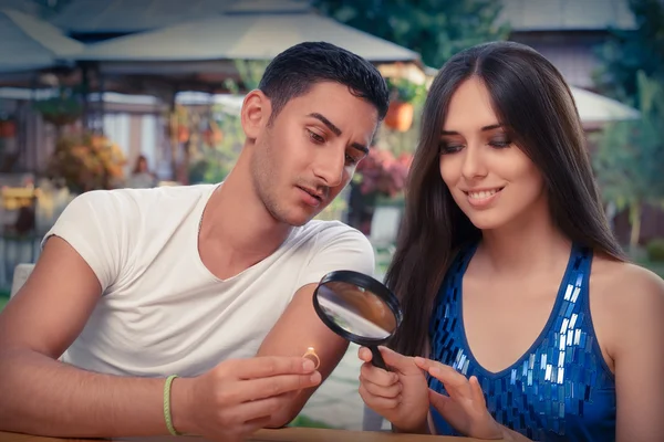 Happy Woman Testing Engagement Ring from Boyfriend with Magnifier — Stock Photo, Image