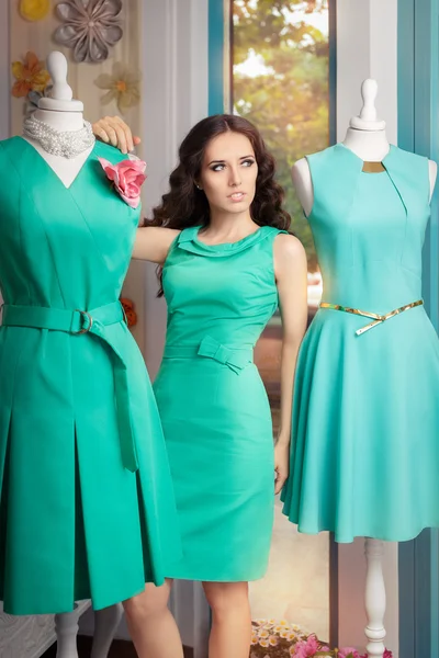 Elegant Woman in Fashion Store among Mannequins — Stock Photo, Image