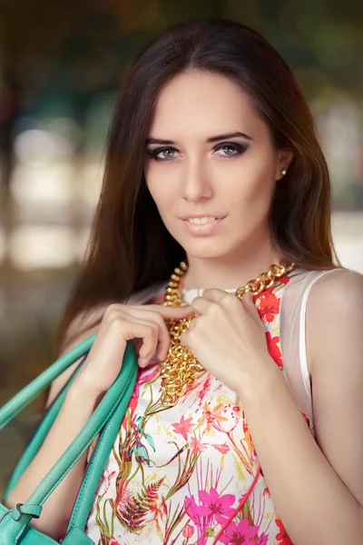 Stylish Woman Wearing Floral Dress, Necklace and Purse — 스톡 사진