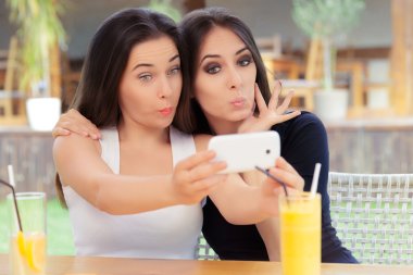 Funny Girls Taking a Selfie Together clipart