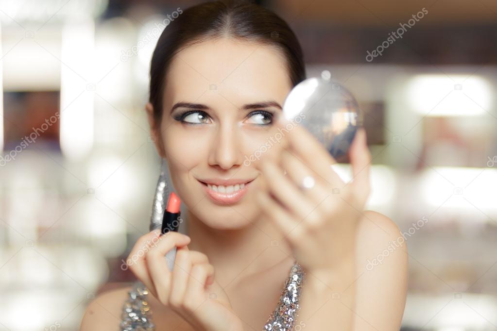 Glamour Woman with Lipstick and Make-up mirror