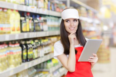 Smiling Supermarket Employee Holding a Pc Tablet clipart