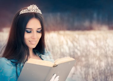 Beautiful Snow Queen Reading a Book clipart