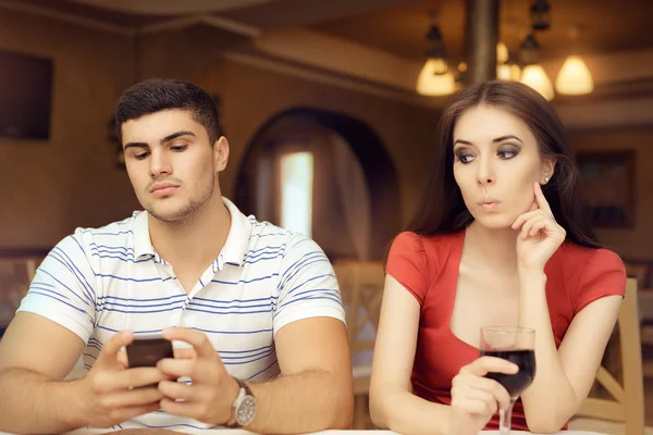 Curious Girl Spying Boyfriend on Smartphone — Stock Photo, Image