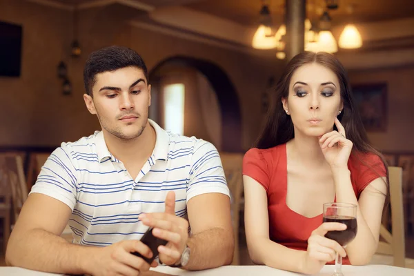 Curious Girl Spying Boyfriend on Smartphone — Stock Photo, Image