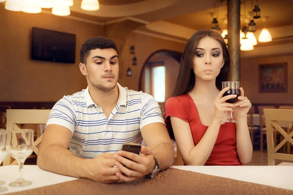 Curious Girl Spying Boyfriend on Smartphone — Stock Photo, Image