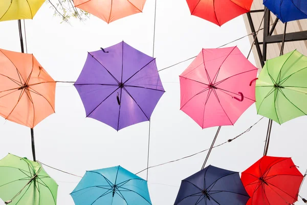 Colorful umbrella hanging on the rope — Stock Photo, Image