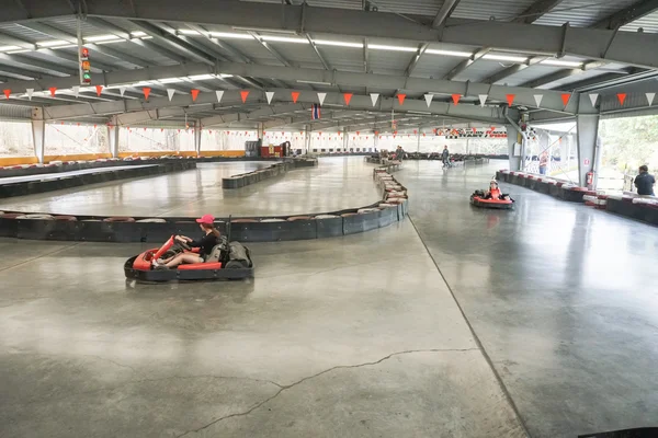 People drive indoor drifter go-cart — Stock Photo, Image