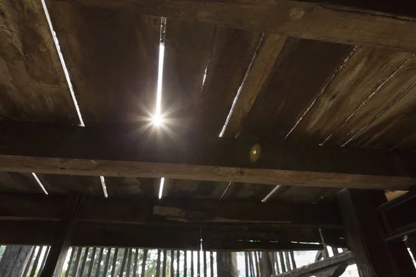 Sunlight through the wooden floor of Thai ancient house — Stock Photo, Image