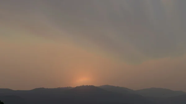 Sunset on mountain hill — Stock Photo, Image