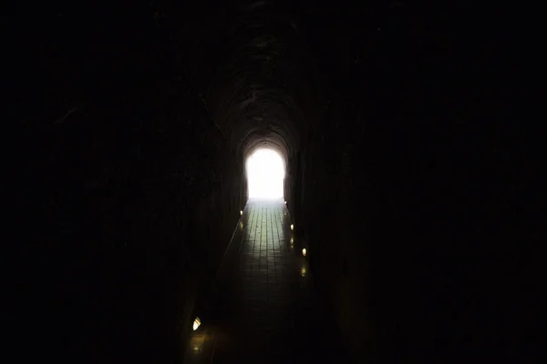 Light at the end of cave tunnel — Stock Photo, Image