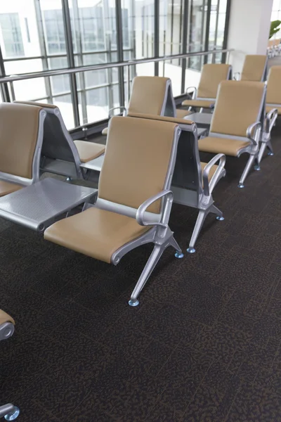 Brown leather chair in airport terminal Royalty Free Stock Photos
