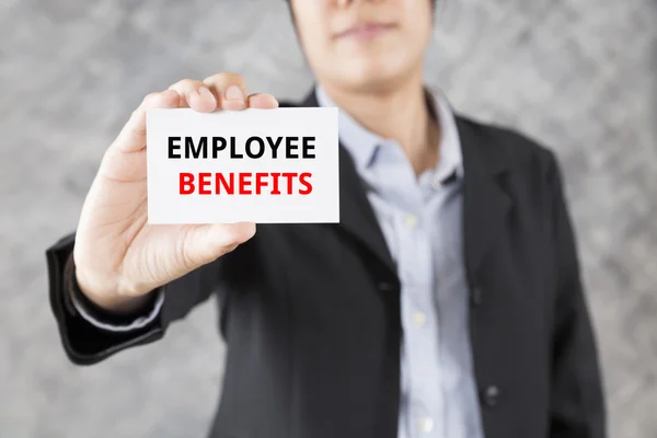 Businessman presenting business card with word employee benefits — Stock Photo, Image