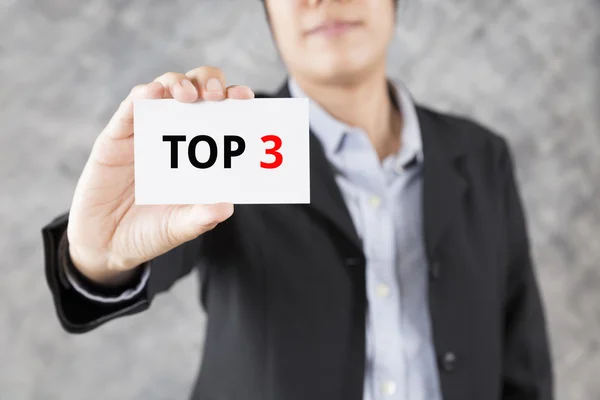 Businessman presenting business card with word top 3 — Stock Photo, Image