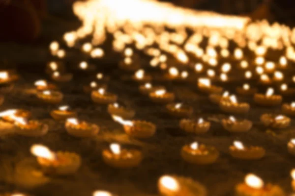 Blur image of candle light glowing at night — Stock Photo, Image