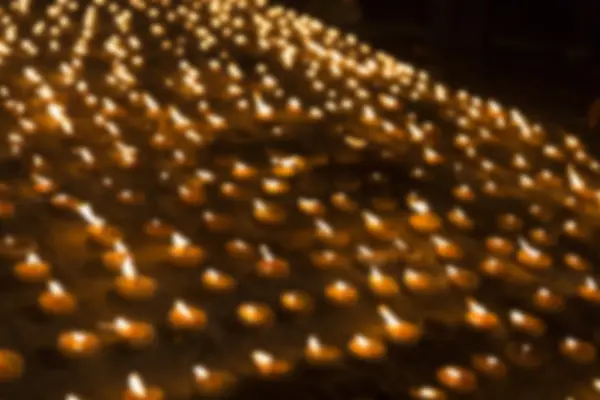 Blur image of candle light glowing at night — Stock Photo, Image