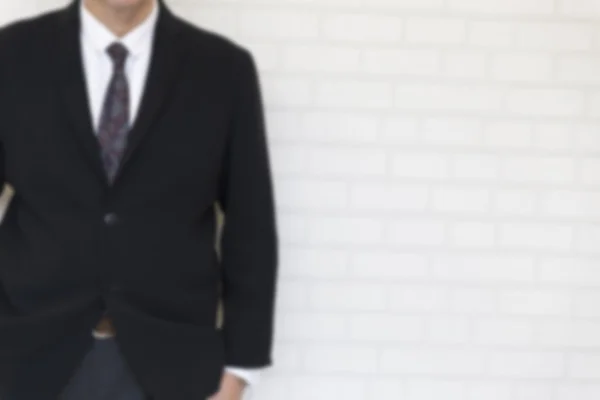 Affärsman hand i fickan - oskärpa för användning som bakgrund — Stockfoto