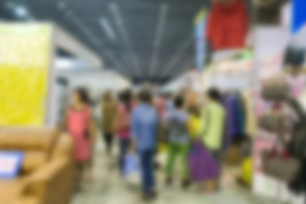 people shopping in exhibition trade fair - blur