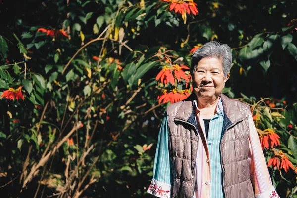 Asian Old Elderly Female Elder Woman Resting Relaxing Flower Garden — Stock Photo, Image