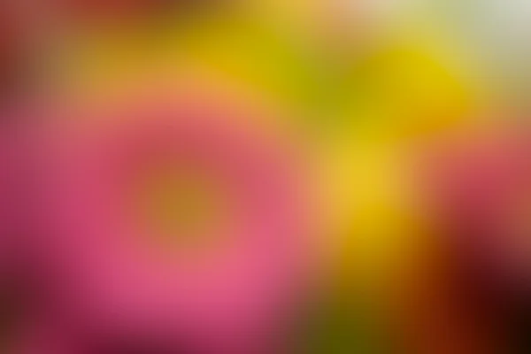Das verschwommene Bild von rosa, gelben und grünen Farbtönen abstrakt — Stockfoto