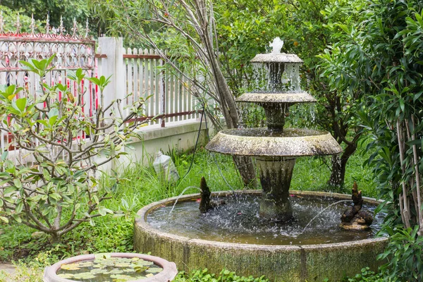 The small ornamental fountain in the garden — Stock Photo, Image