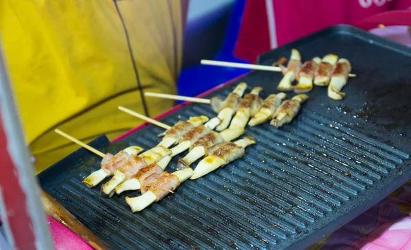 Mushroom wrap with bacon skewer — Stock Photo, Image