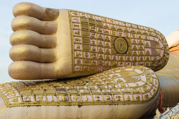 the religious symbol sculpture on buddha feet statue