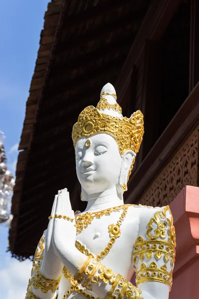 Asian angel sculpture wearing golden jewelry — Stock Photo, Image