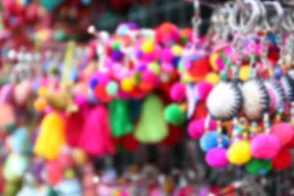 Blurry image of colorful handmade souvenir key chain — Stock Photo, Image