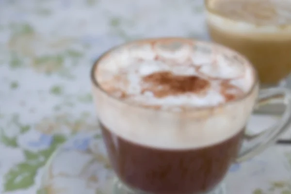 Suddiga defocused hett mocha och varm cappuccino för bakgrund — Stockfoto