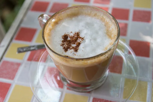 Hot cappuccino coffee with cinnamon topping — Stock Photo, Image