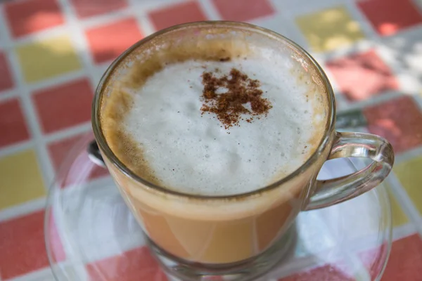 Hot cappuccino coffee with cinnamon topping — Stock Photo, Image