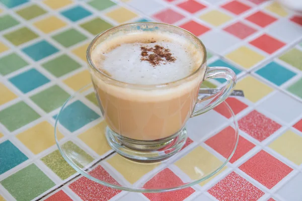 Hot cappuccino coffee with cinnamon topping — Stock Photo, Image