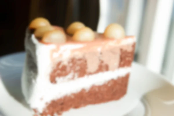 Torta de chocolate desenfocada borrosa con Macadamia en la parte superior para backgr — Foto de Stock