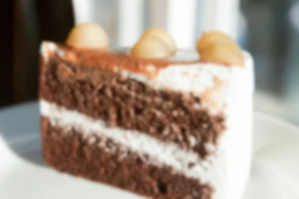 模糊的离焦之上，供高建群的澳洲坚果巧克力蛋糕 — 图库照片