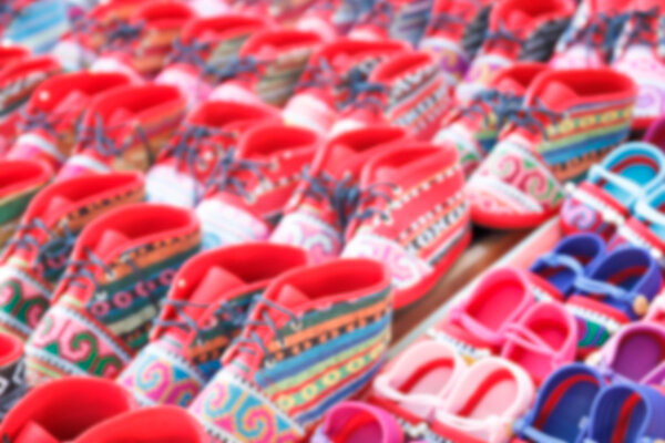 blurry defocused colorful handmade fabric kid shoe of thailand t